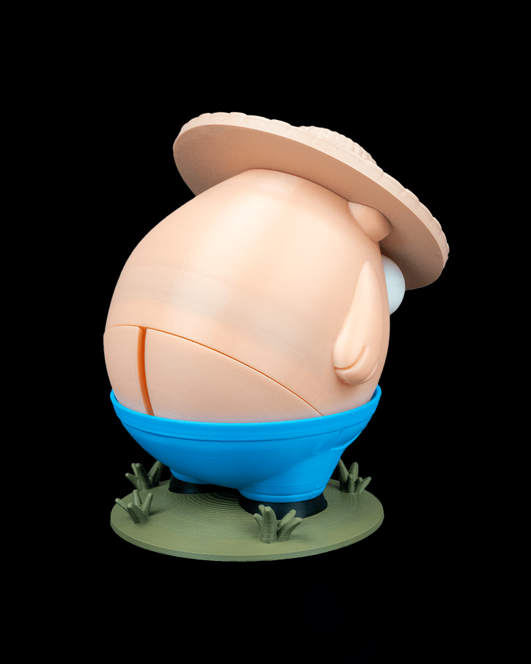 Cartoon character in an egg costume with a hat on a black background