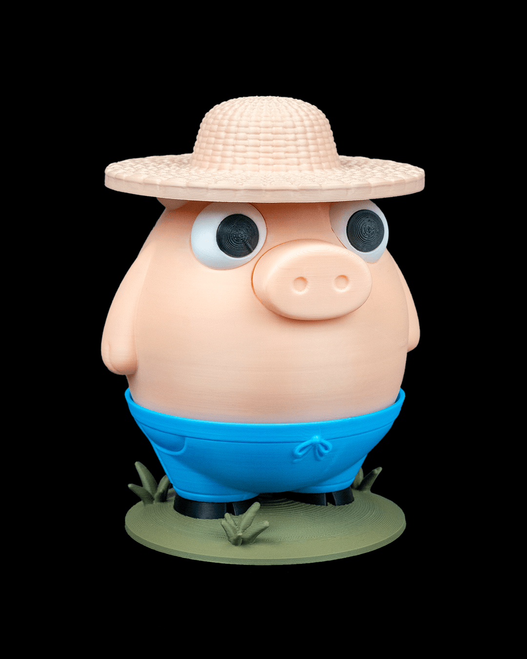 Cartoonish pig figurine wearing a straw hat and blue shorts on a black background
